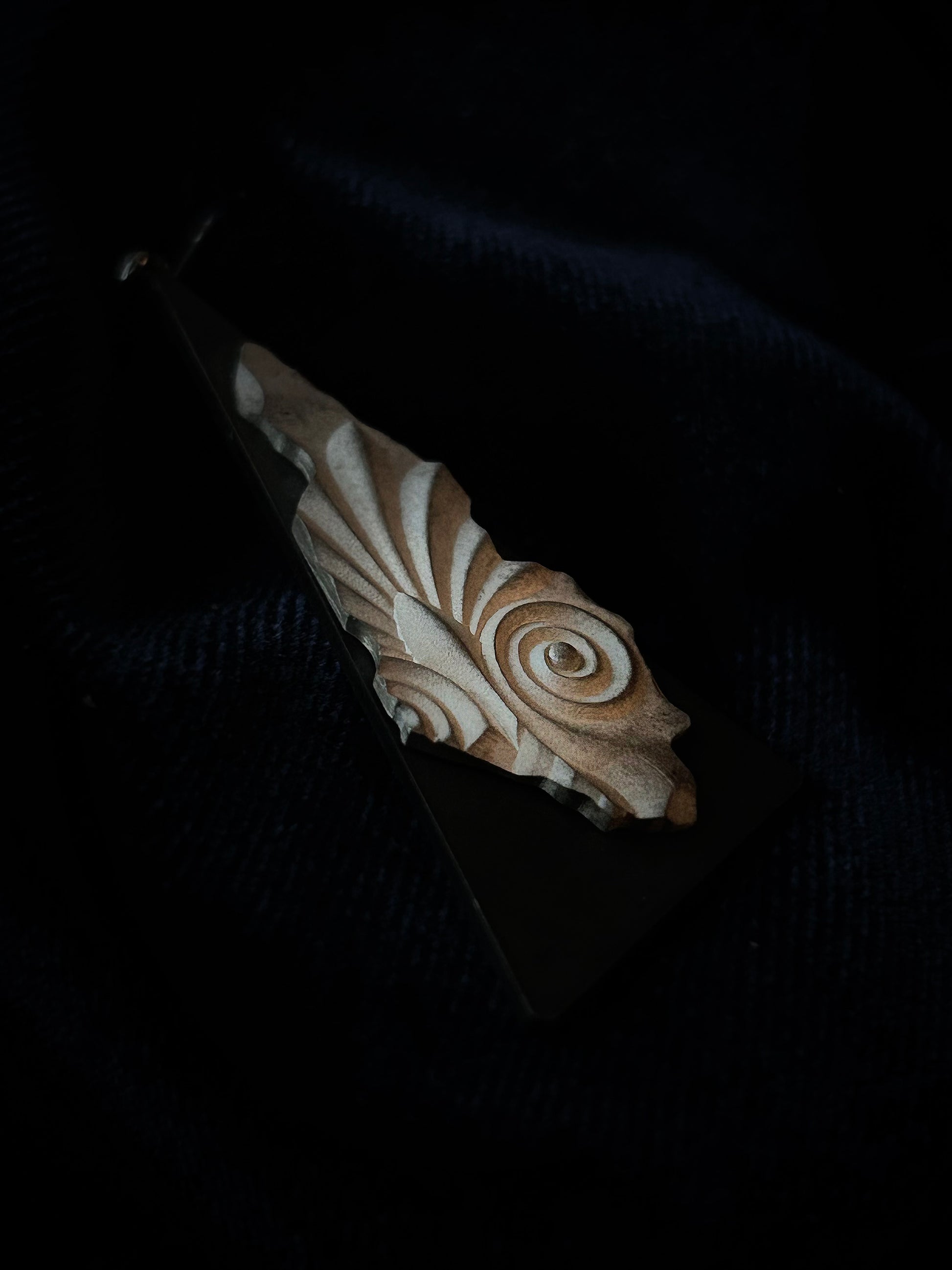 Carvings with intricate patterns on a dark background
